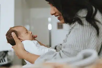 Mother holding her infant baby