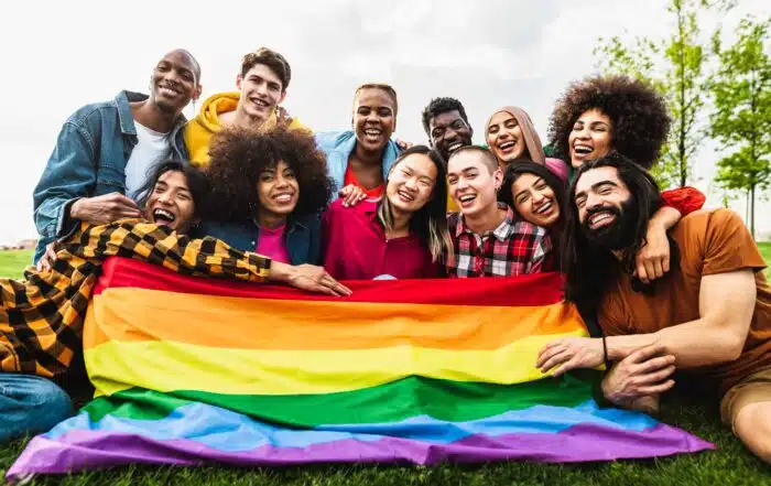 Happy diverse young friends celebrating gay pride festival