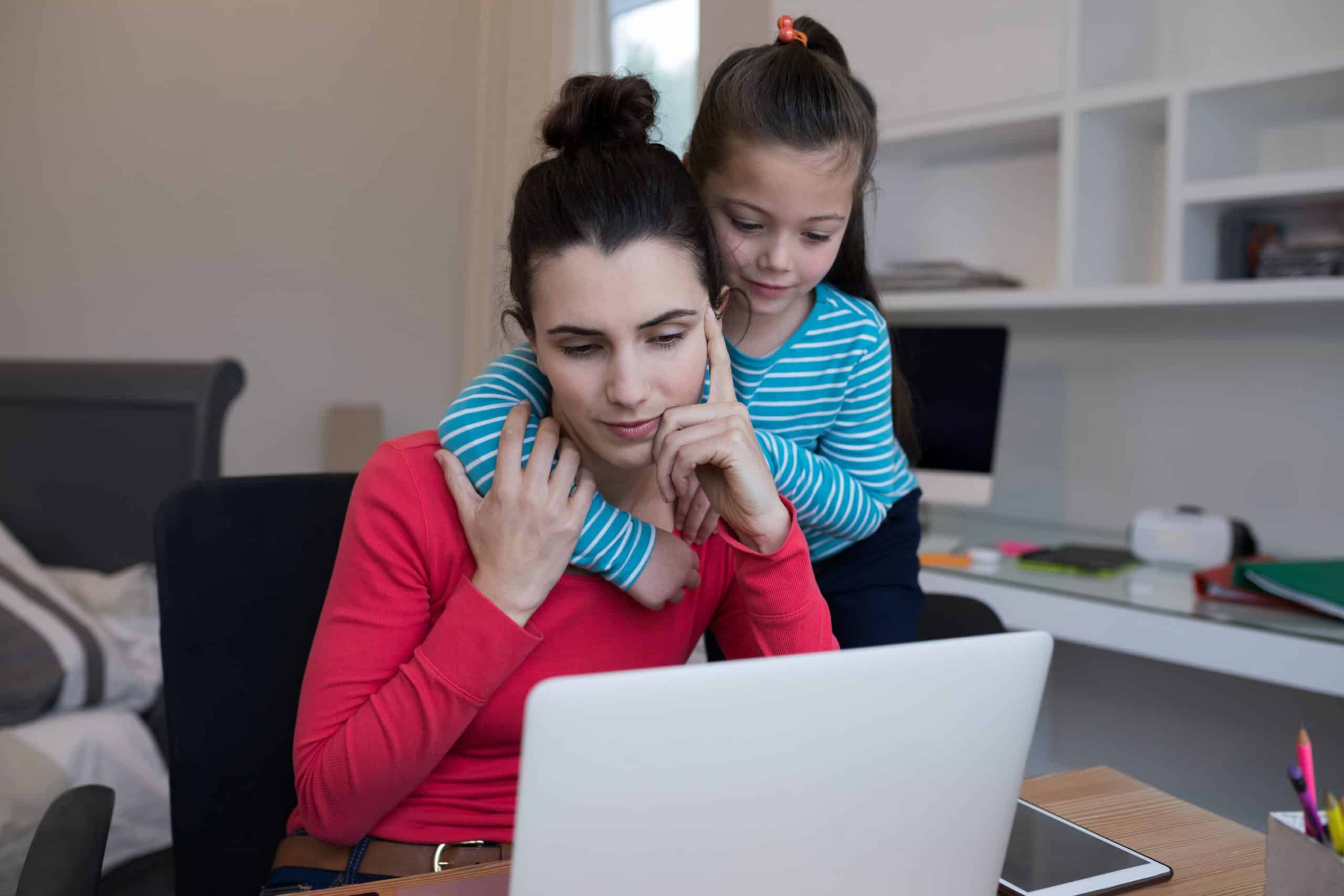 Mother and daughter using laptop at desk Mother and daughter using laptop at desk