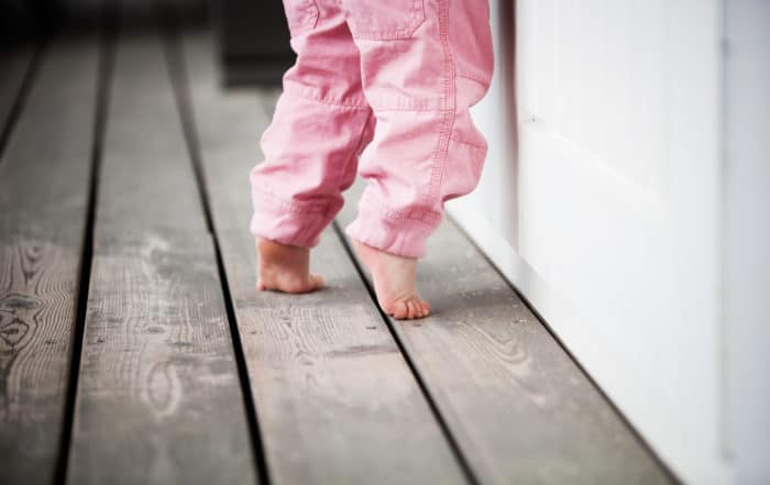 Baby walking on tiptoes