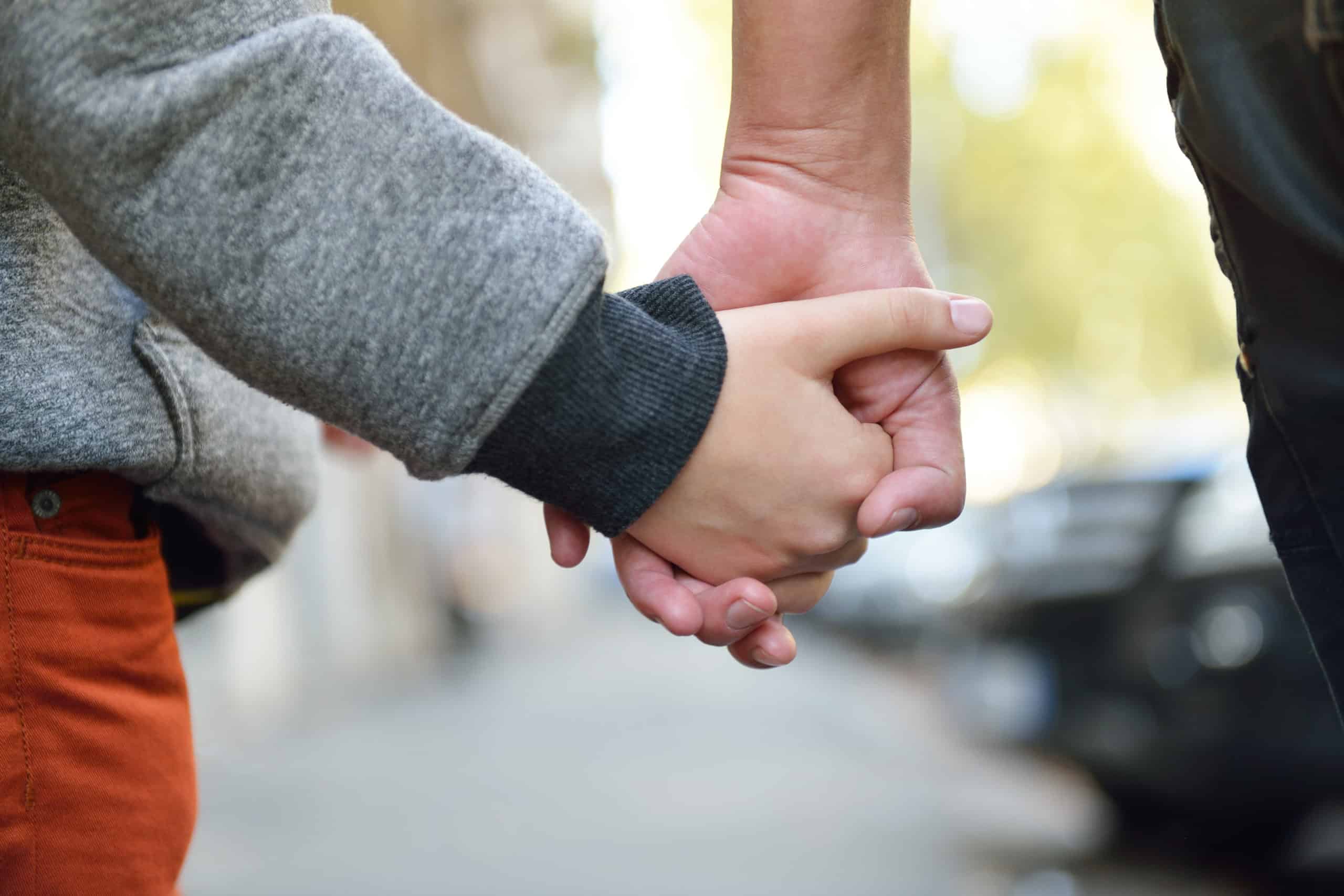 holding hands Hands of mother and child outdoor closeup.