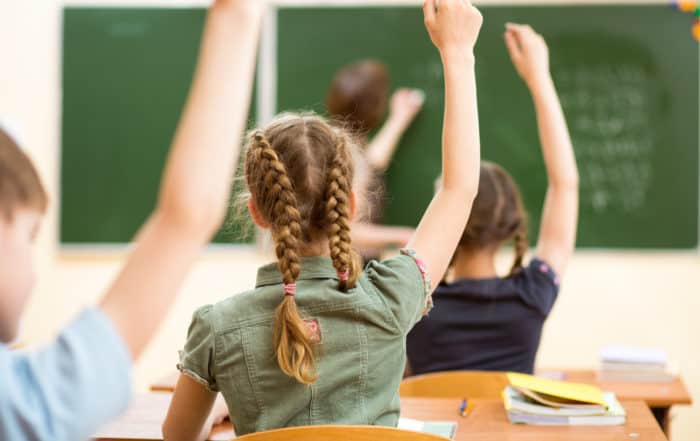 School children in classroom at lesson