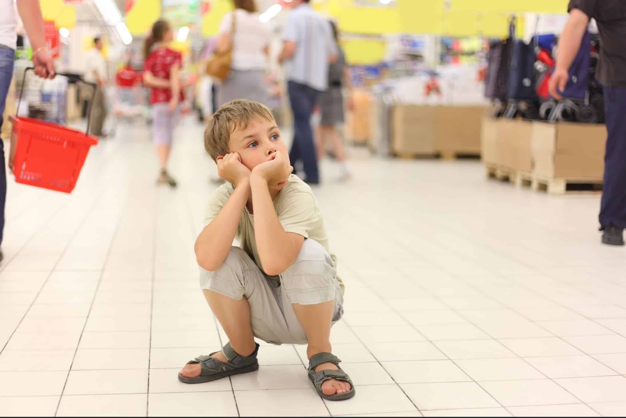 Child looking at items in a supermarket