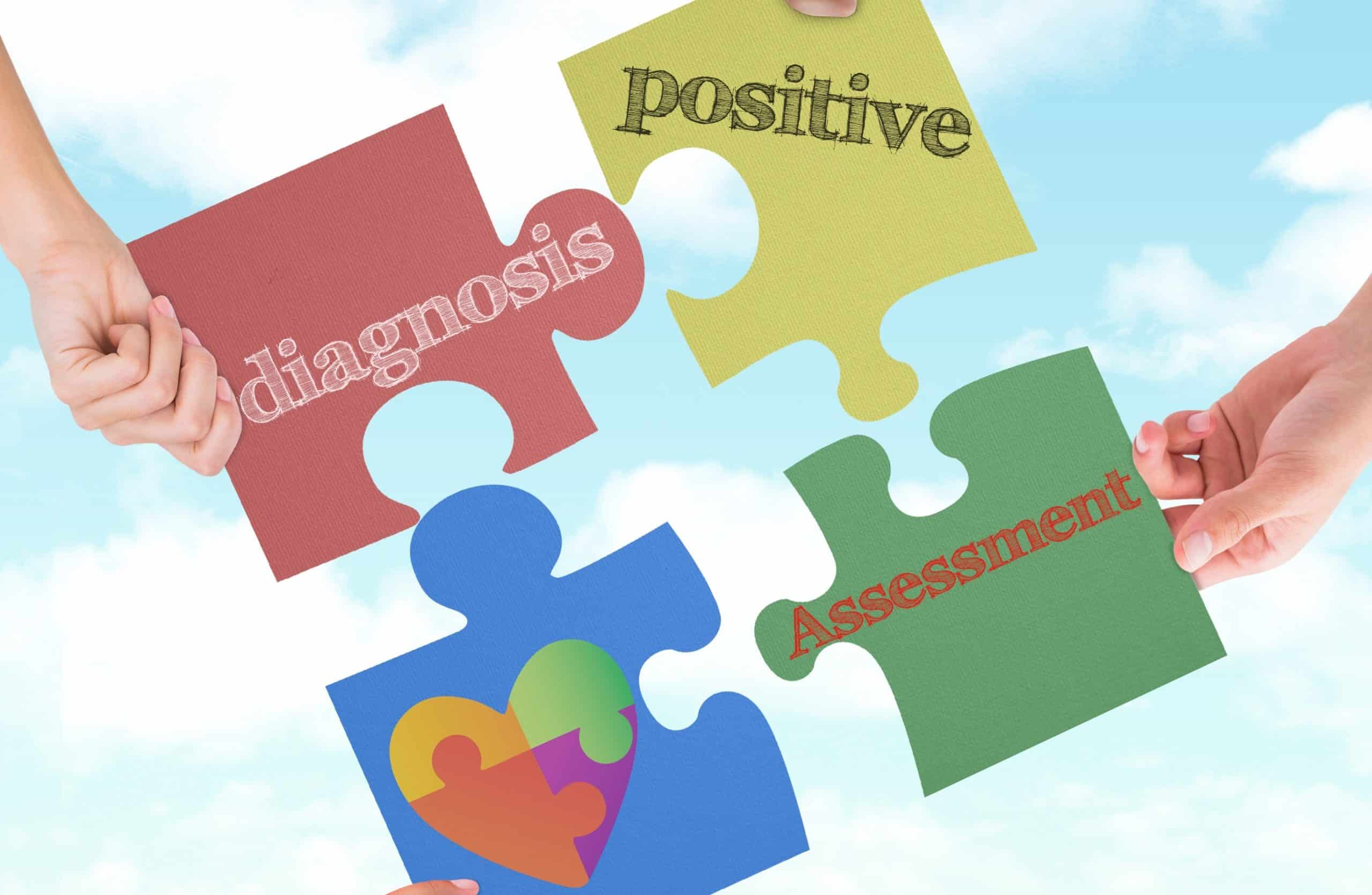 People holding up puzzle pieces with different words written on them