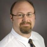 Professional headshot of a person