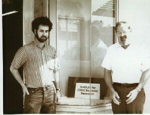 Stephen M. Edelson and Bernard Rimland standing outside of building