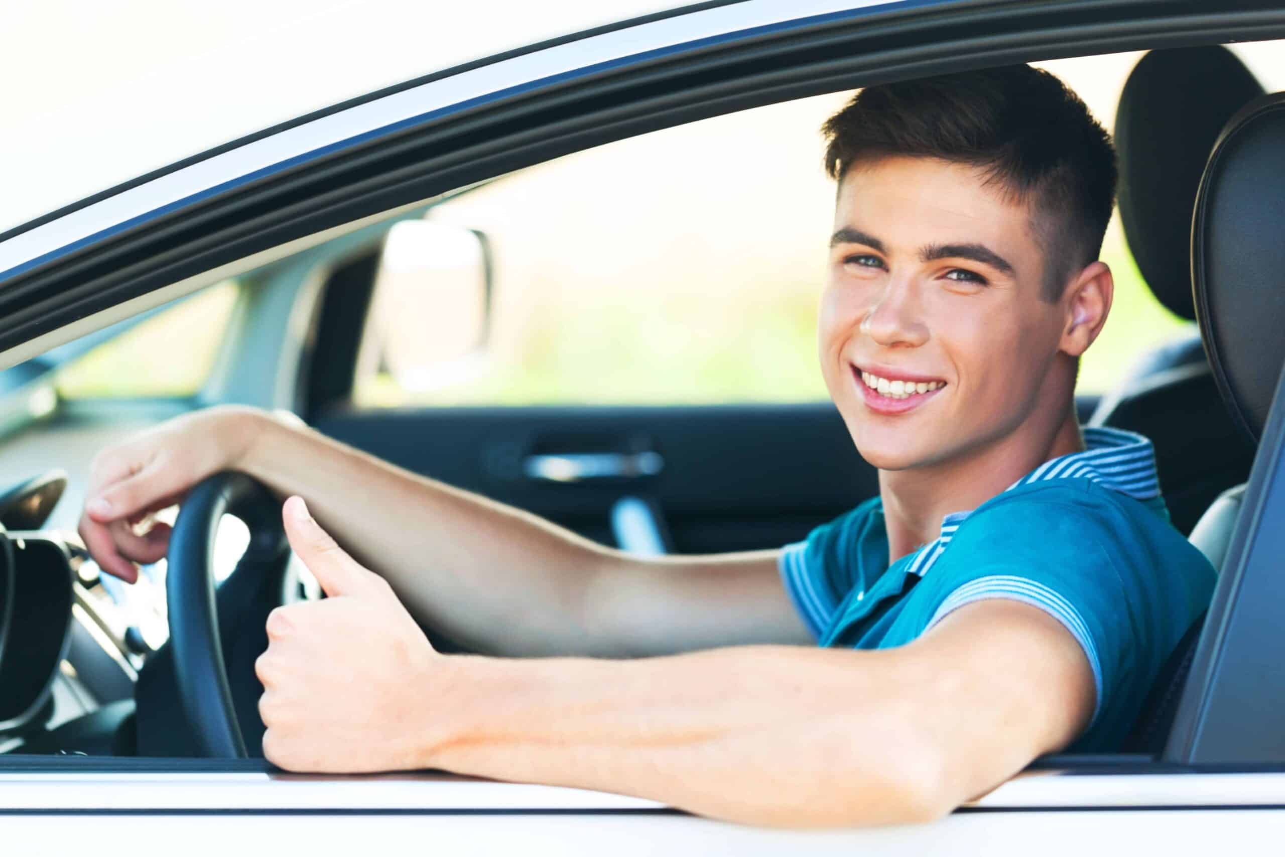 Portrait of Young Man in his Car Showing Thumbs Up Portrait of Young Man in his Car Showing Thumbs Up