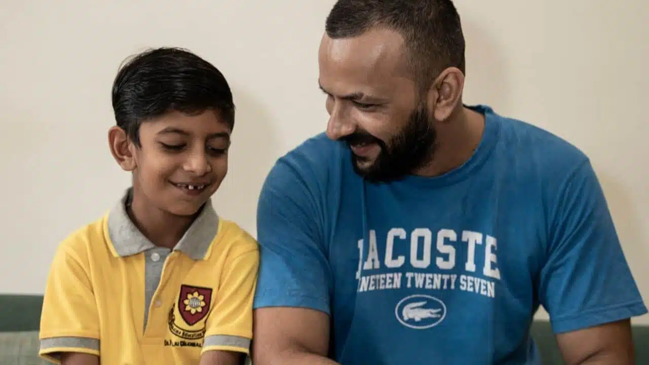 Father and son smiling with happiness