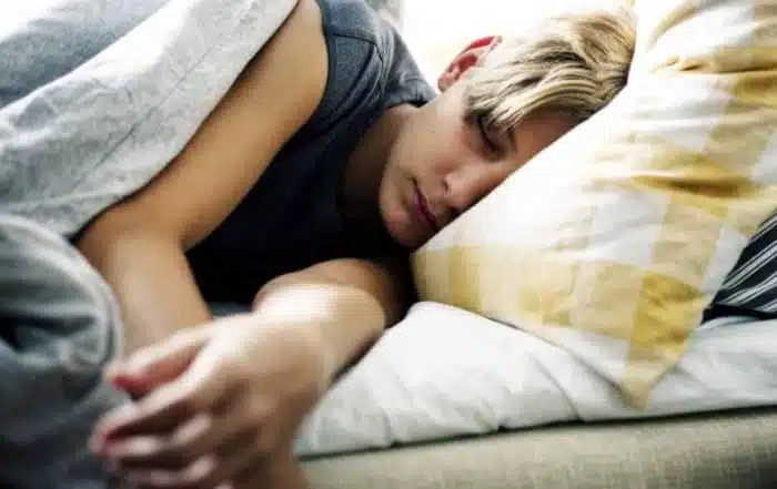 Young kid having a peaceful nap in bed