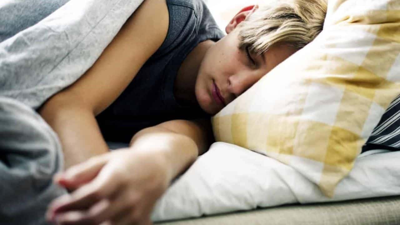 sleep Young kid having a peaceful nap in bed