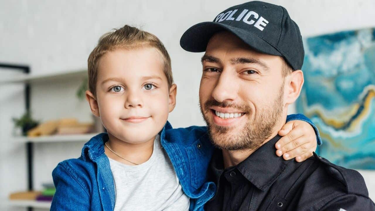 Young child giving a hug to a man