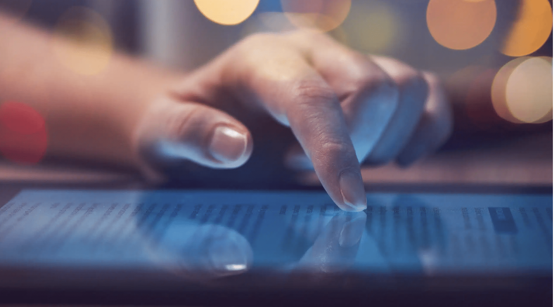 Woman reading online news on digital tablet